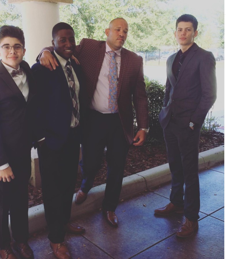 Dayan Rodriguez wearing a suit